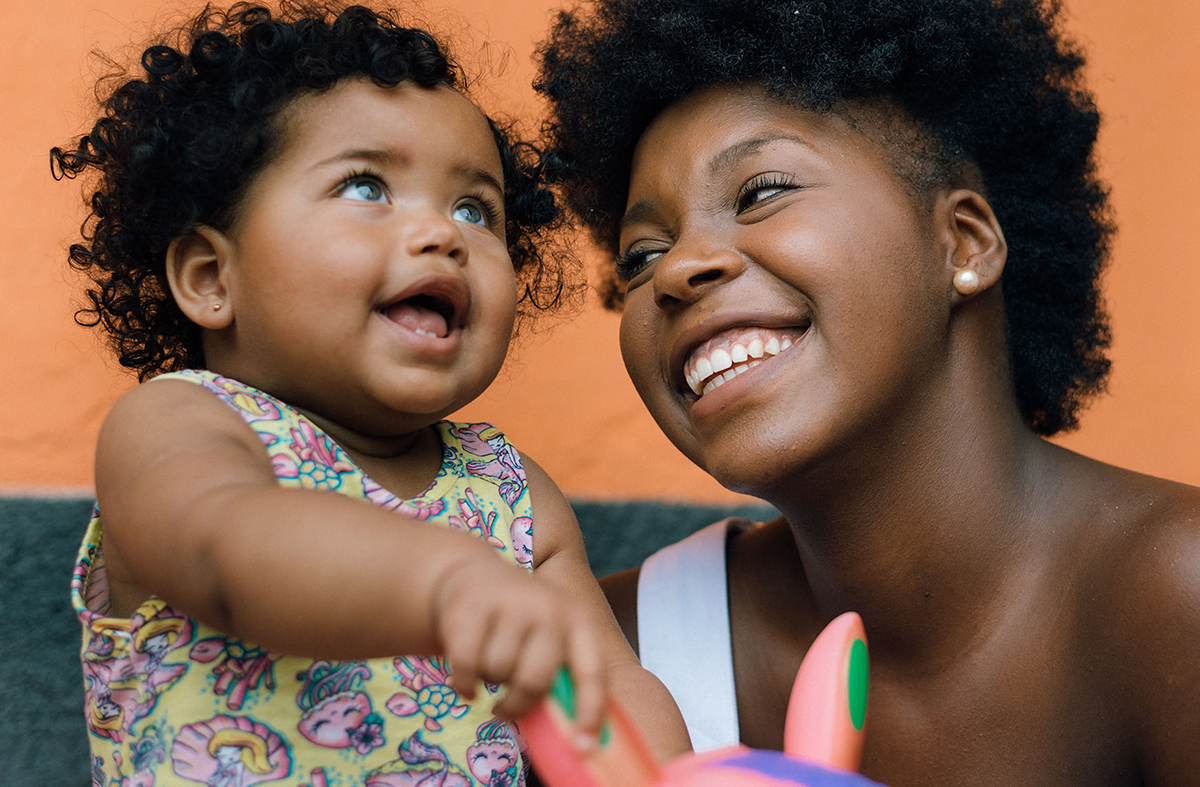 A woman holding her child